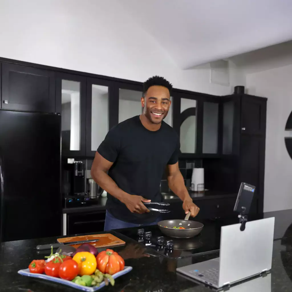 How to Go Live - A culinary creator is preparing a meal while streaming, and answering fans' recipe questions