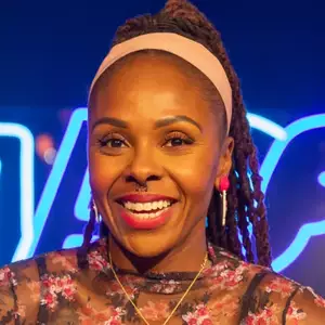 Comedian Kellye Howard poses in front of the LMAOF logo