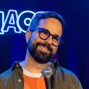 Comedian Anthony Bonazzo performing stand-up comedy on stage at LMAOF