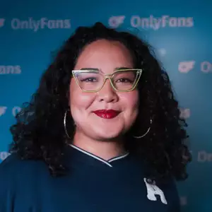 Comedian Erika Ehler poses in front of the LMAOF logo