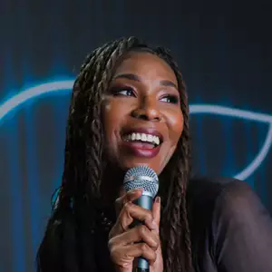 Comedian Fatimah Taliah performing stand-up comedy on stage at LMAOF