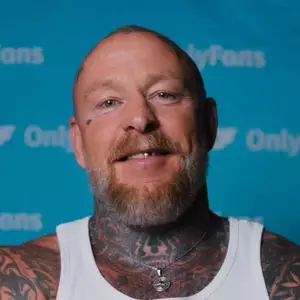 Comedian Jason Ellis poses in front of the LMAOF logo