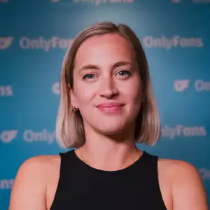 Comedian Lily Phillips poses in front of the LMAOF logo