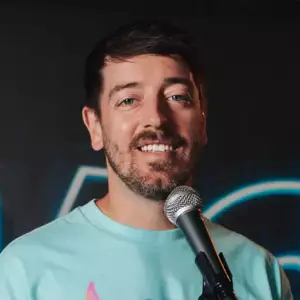Comedian Matty Chymbor poses in front of the LMAOF logo