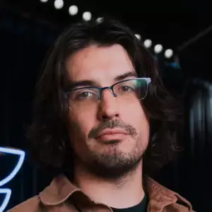Comedian Radu Bondar poses in front of the LMAOF logo