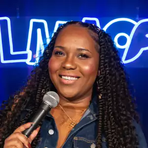 Comedian Rebecca O'Neal performing stand-up comedy on stage at LMAOF