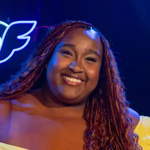 Comedian Victoria Vincent poses in front of the LMAOF logo