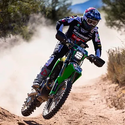 Pato Cabrera, desert racer, goes slightly airborne atop his dirt bike during a competition.
