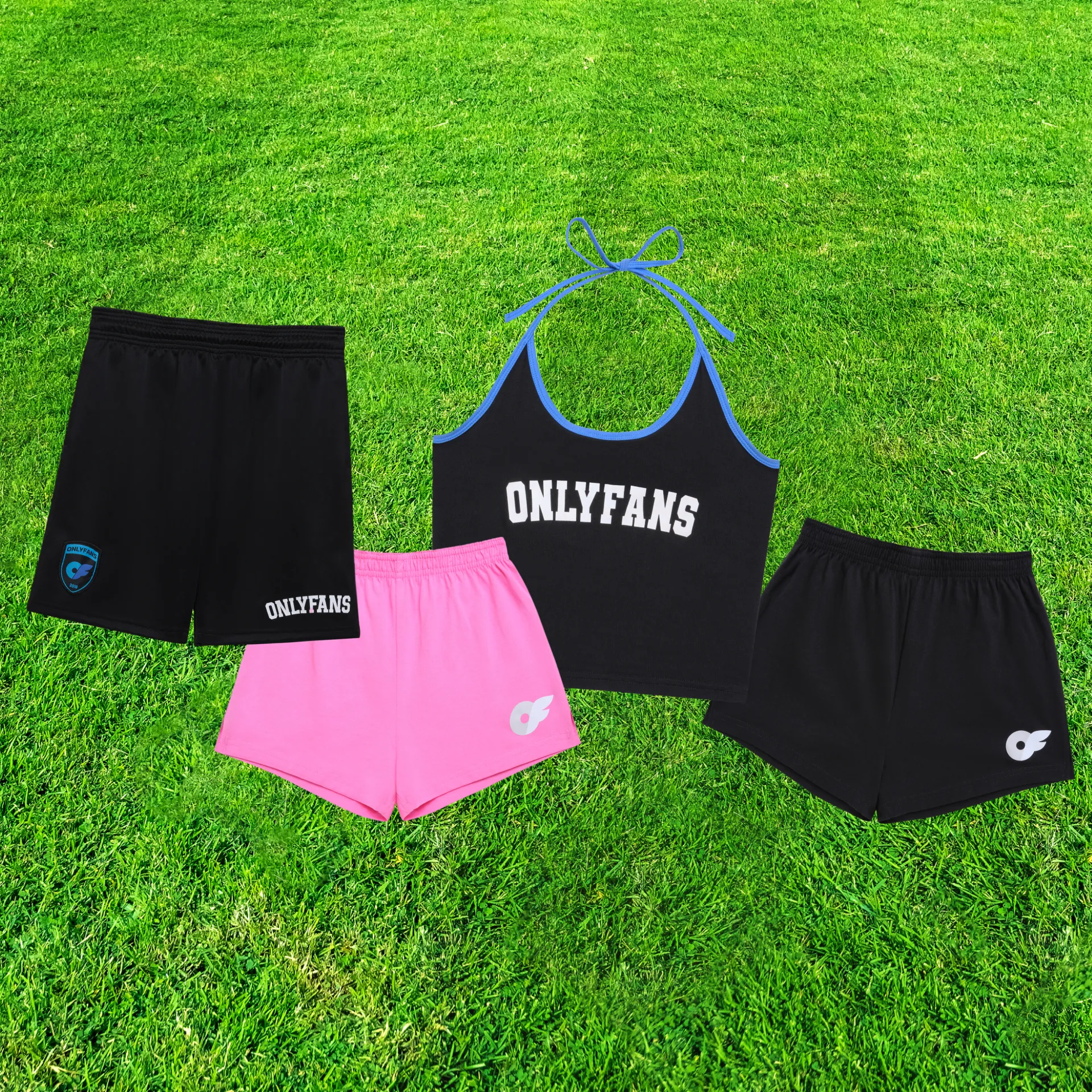 Graphic showcasing sports-inspired apparel from The Stadium Kit by OF Merch, including a black halter top, black mesh shorts, black varsity shorts, and pink varsity shorts displayed on a grassy playing field.