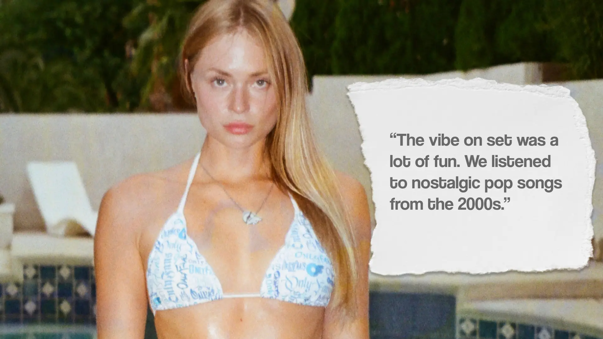 Kateryna Dudka poses poolside wearing the OF Merch Striped bikini. Quote: "The vibe on set was a lot of fun. We listened to nostalgic pop songs from the 2000s."